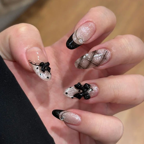 Artful Nail Art with Bow and Rhinestone Decorations Bowlift