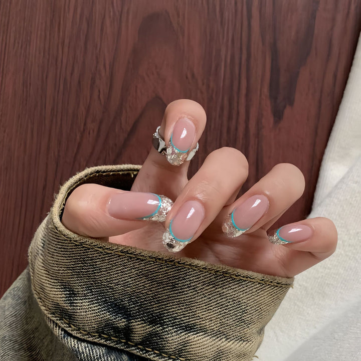 Artificial nails with shimmering glitter and elegant French-tip design Bowlift