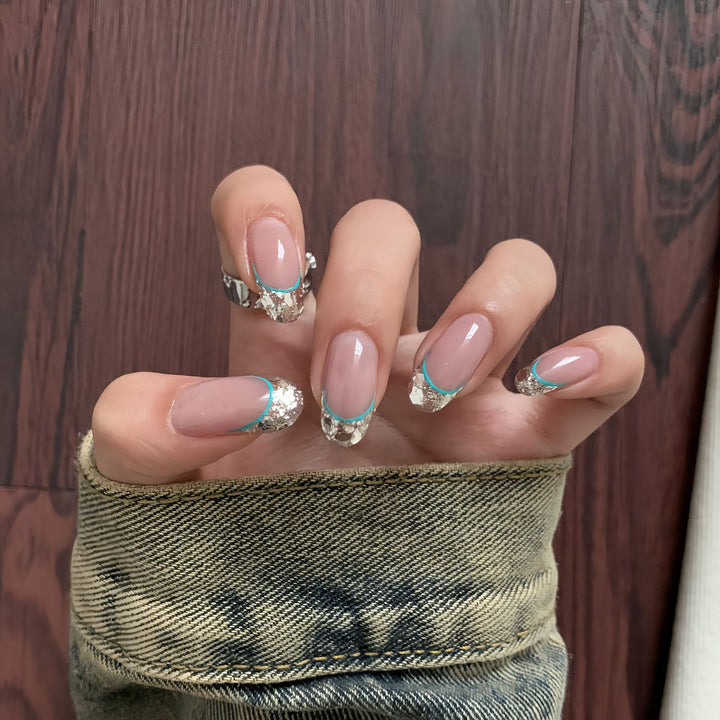 Artificial nails with shimmering glitter and elegant French-tip design Bowlift