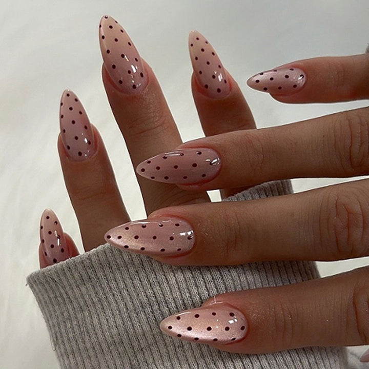 Artful stiletto nails with elegant floral design and glitter details Bowlift