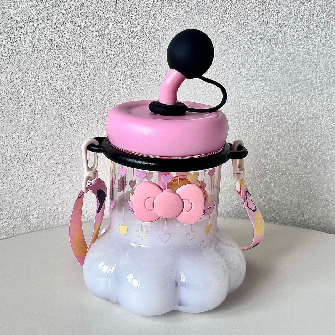 Women's water bottle with integrated silicone carrying handle and playful design Bowlift