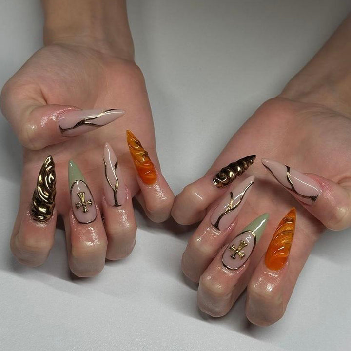 Artful stiletto nails with glitter and motif decorations Bowlift