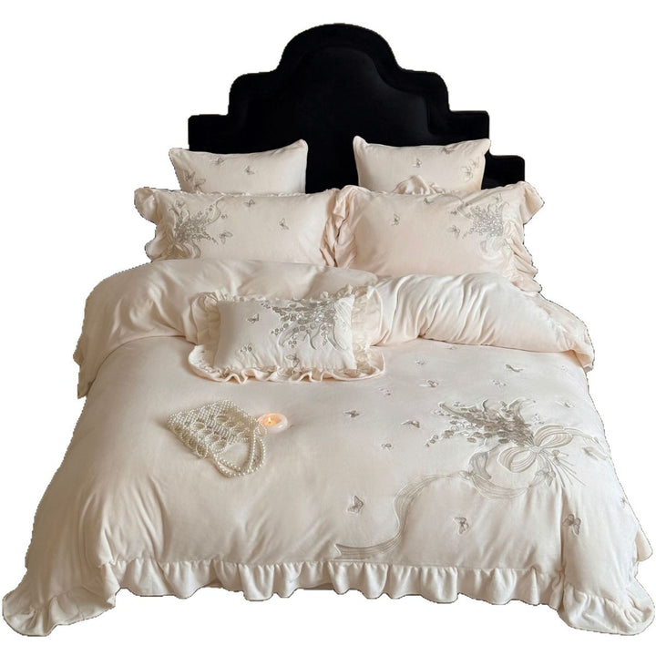 Luxurious bedding set with ruffles and floral embroidery