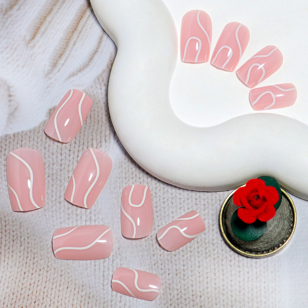 Elegant Press-On Nail Design with Artistic White Swirl Bowlift