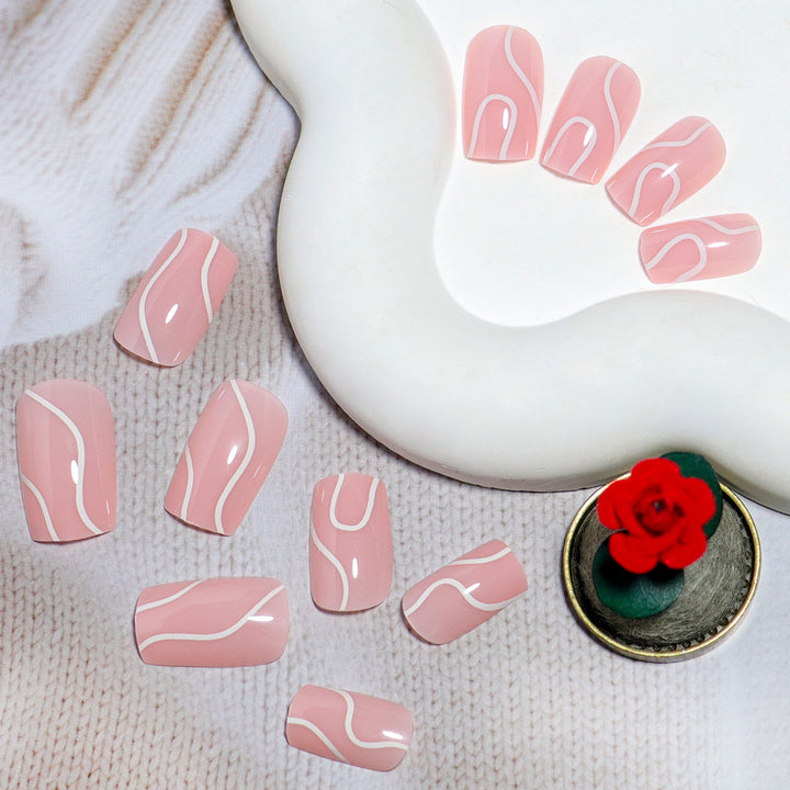 Elegant Press-On Nail Design with Artistic White Swirl Bowlift