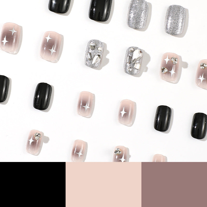 Elegant Nail Art with Glitter and Star Motifs Bowlift