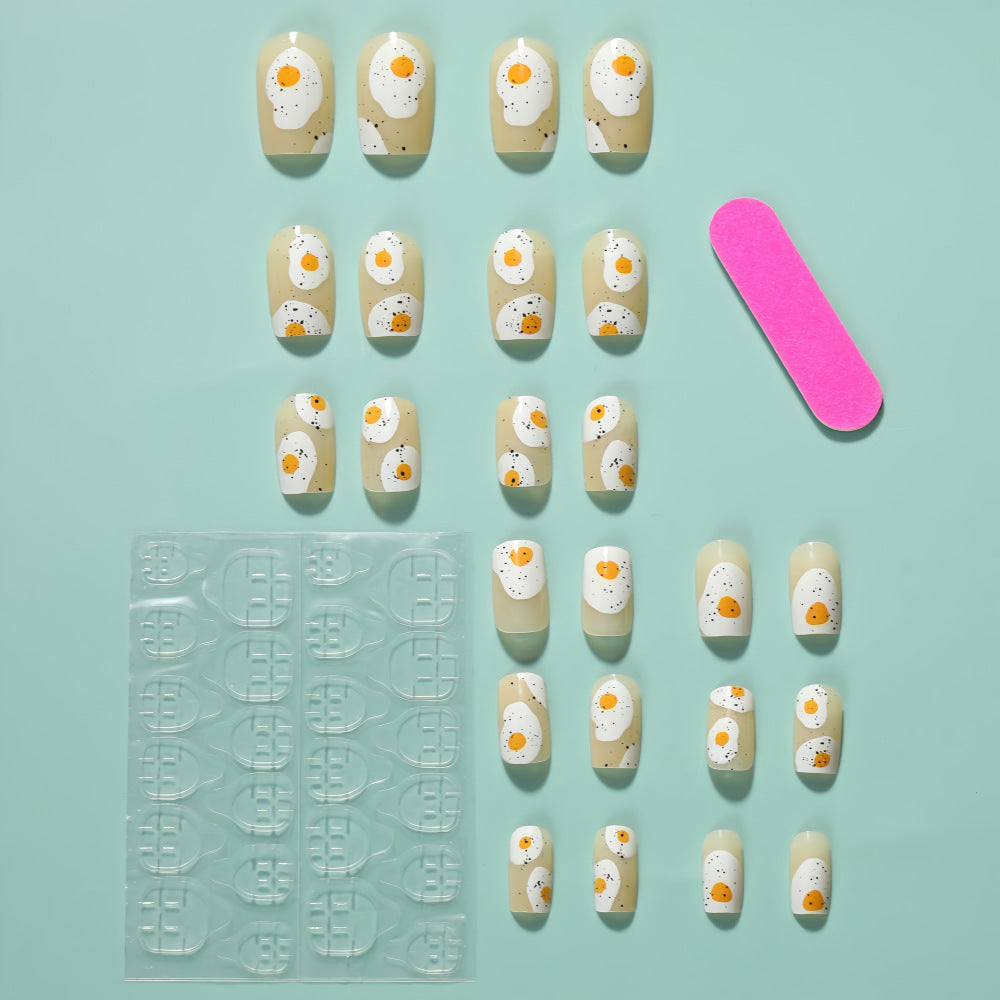 Artificial nails in creative fried egg design Bowlift