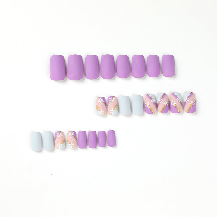 Artistic nail designs with floral motifs and glitter accents Bowlift