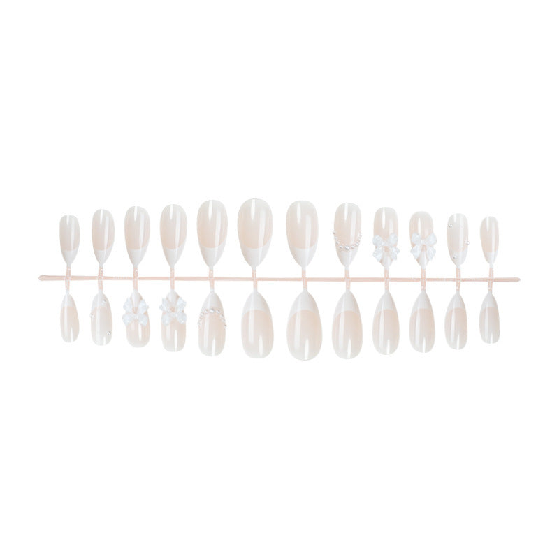 Artificial nail set with elegant bows and pearl decorations Bowlift