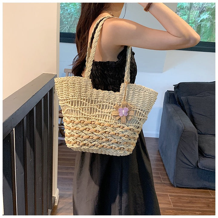 Handwoven beach bag with floral accents Bowlift