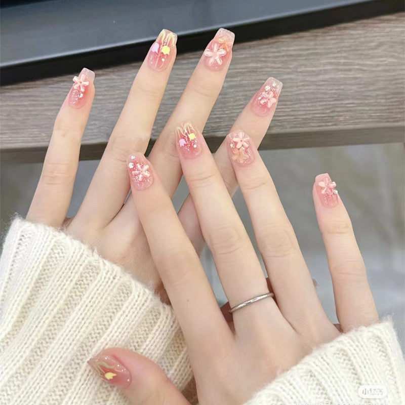 Artificial nails with floral design and glitter effects Bowlift
