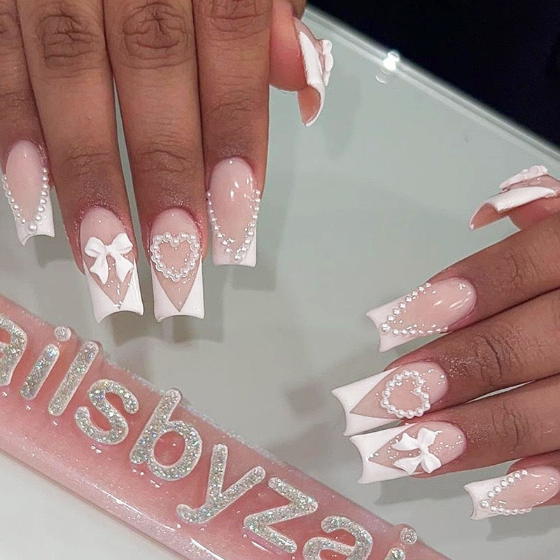 Artificial nail set with filigree hearts and bow decorations Bowlift