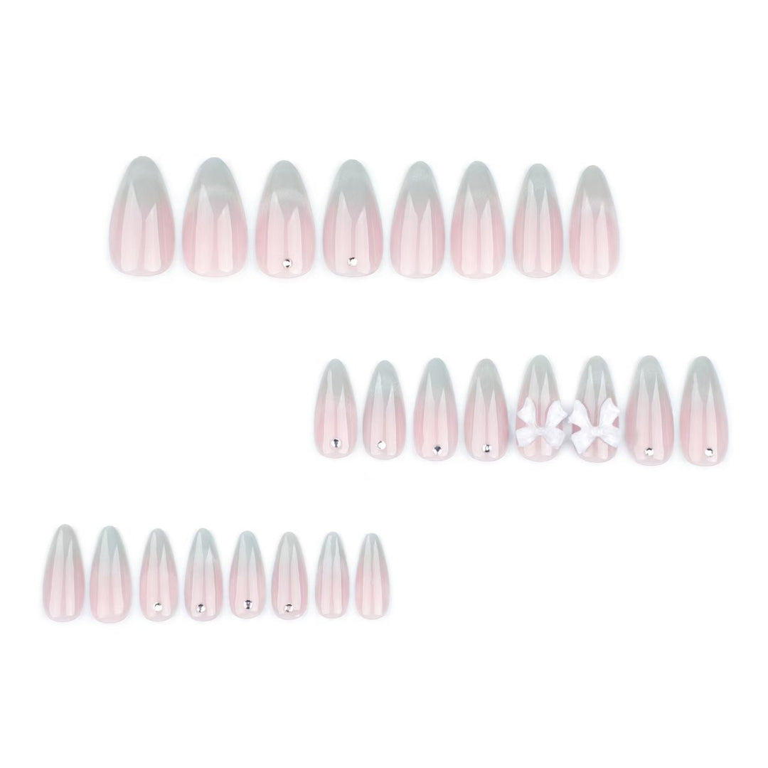 Elegant Stiletto Press-On Nails with Decorative Bow and Gemstone Accents Bowlift