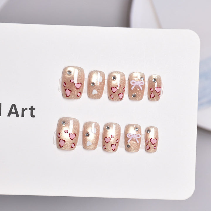 Artistic Press-On Nail Set with Heart and Bow Designs Bowlift