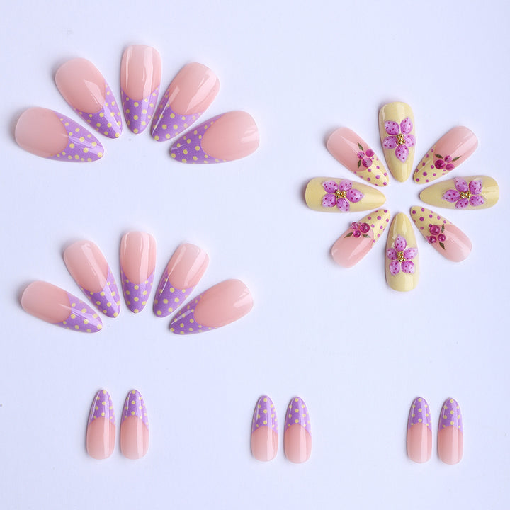 Artificial fingernails with floral design and glitter accents Bowlift