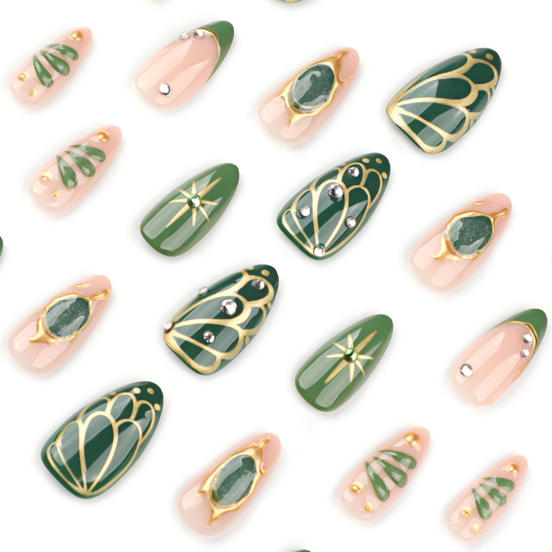 Artistic nail extensions with elegant gold and green shimmer Bowlift