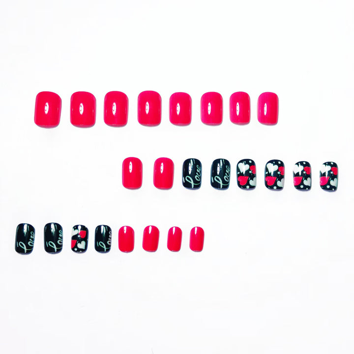 Acrylic nail design with hearts and kiss motifs Bowlift