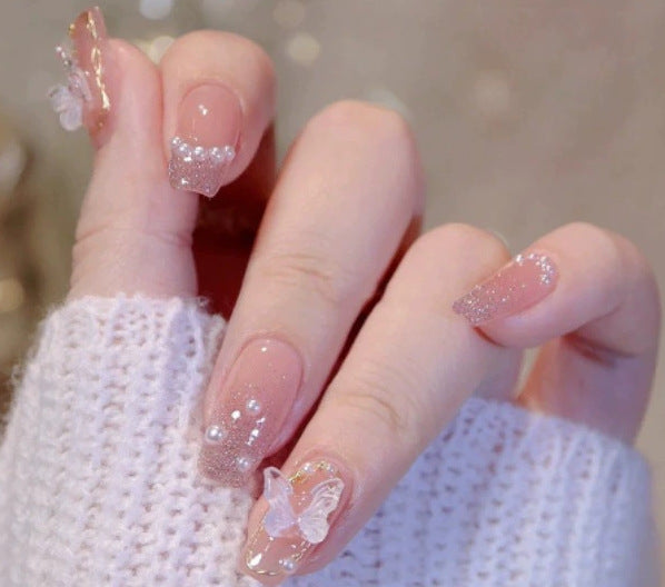 Elegant nail design with pearl embellishment Bowlift