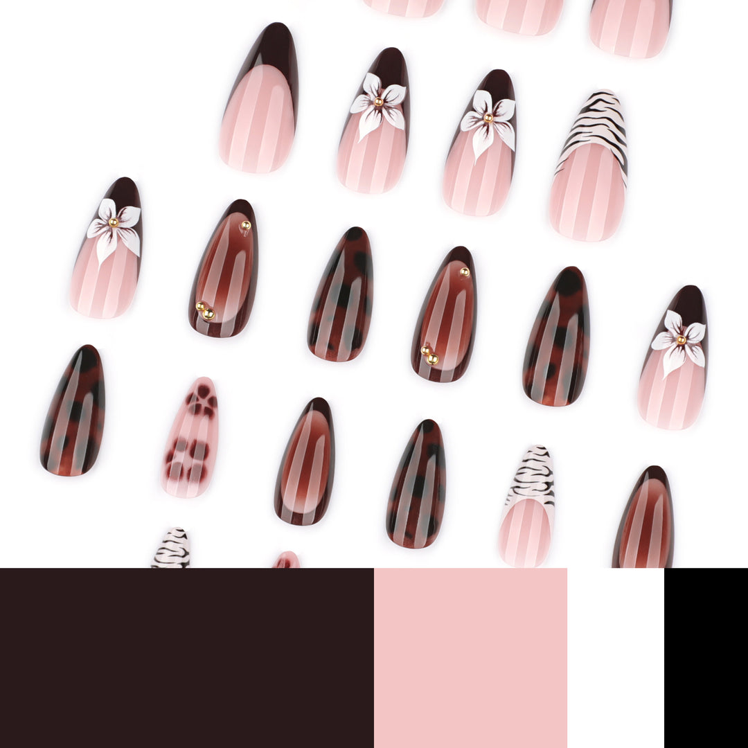 Artistic stiletto nails with elegant floral designs and glitter accents Bowlift