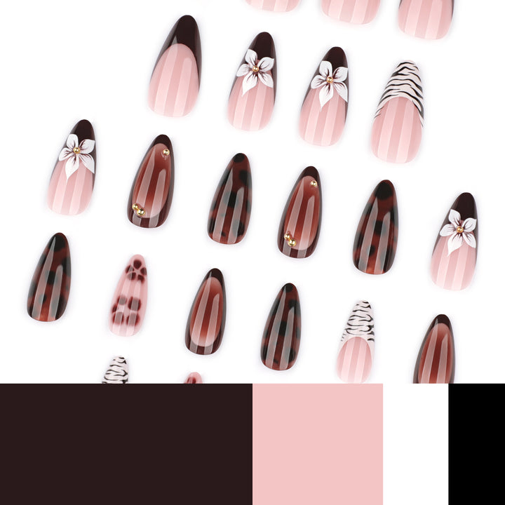 Artistic stiletto nails with elegant floral designs and glitter accents Bowlift