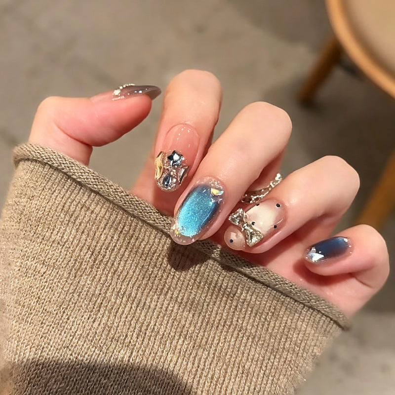 Art nails in elegant premium design with rhinestone and glitter elements Bowlift