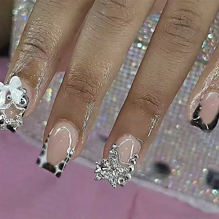 Acrylic nail set with glamorous starlights and elegant embellishments Bowlift