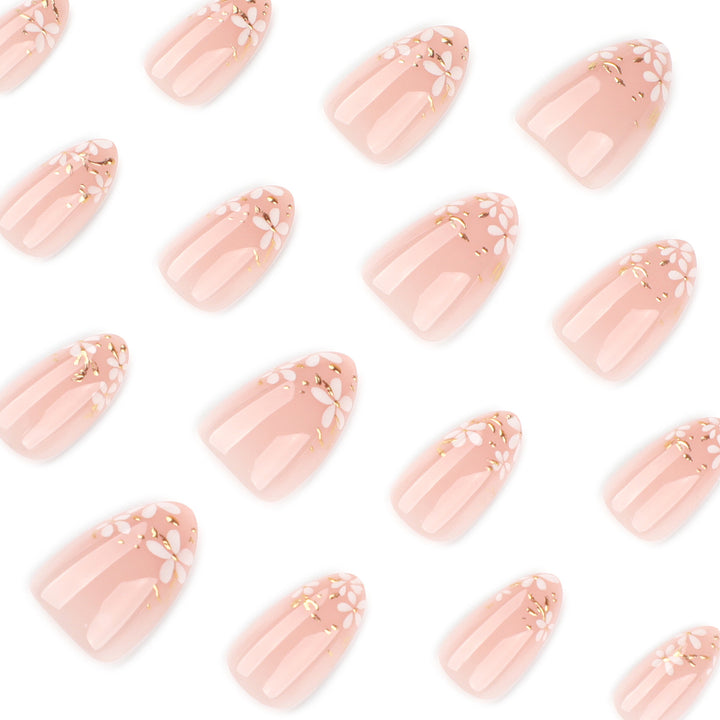 Artful nail art with floral design and glitter accents Bowlift