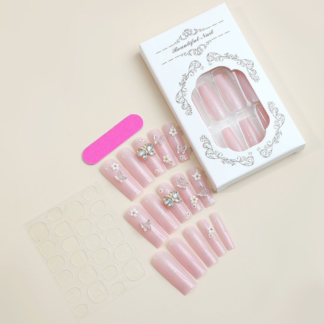 Artificial nail set with floral and glittering accents Bowlift