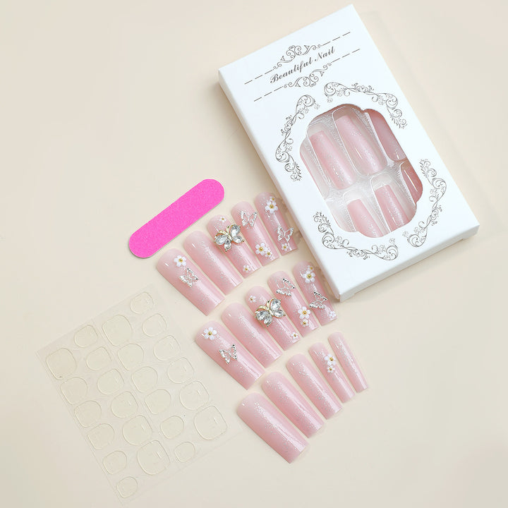 Artificial nail set with floral and glittering accents Bowlift