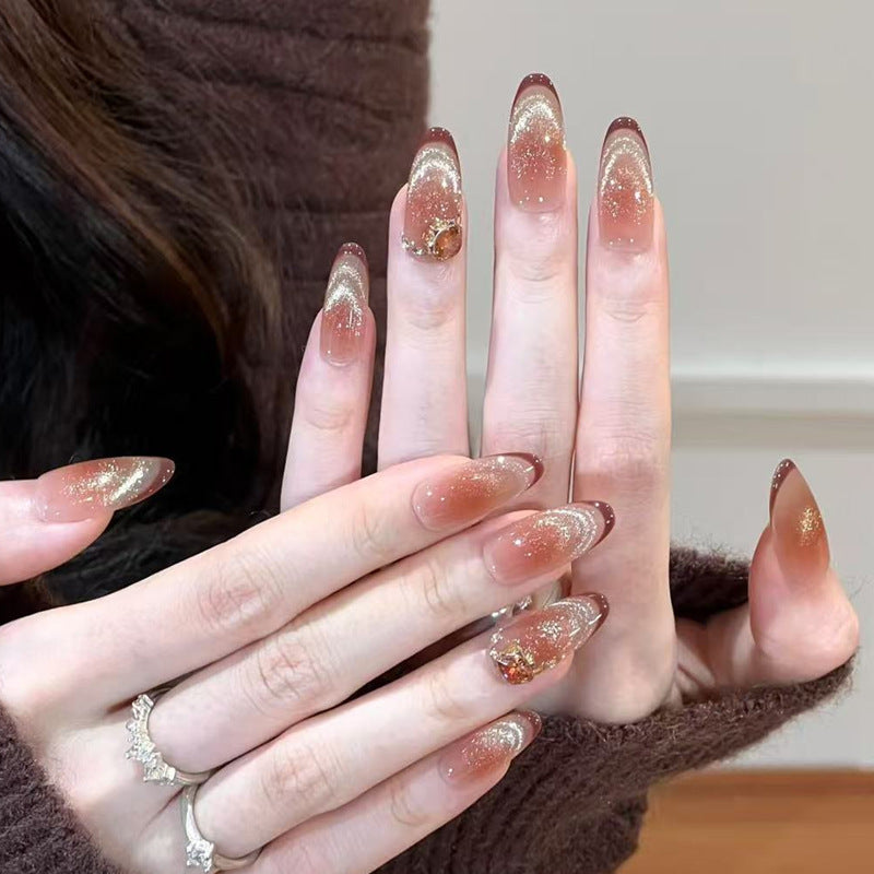 Artificial nail set with festive gift design and elegant glitter accents Bowlift