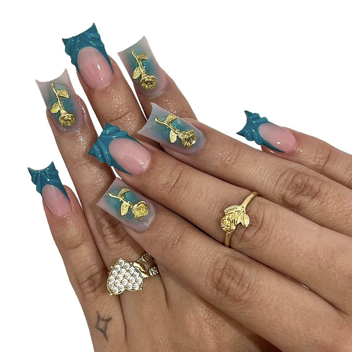 Elegant artificial nail creations with golden embellishments Bowlift
