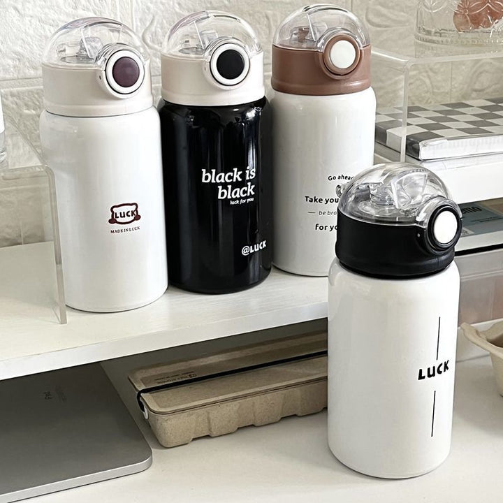 Women's insulated drinking bottle with innovative flip lid and practical handle Bowlift