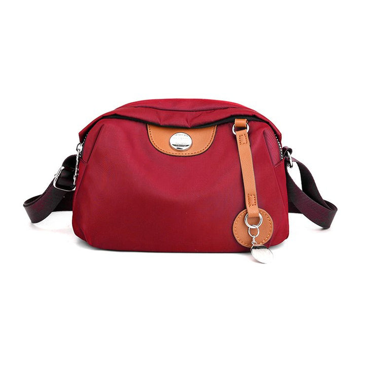 Shoulder bag with adjustable shoulder strap and clear compartment system Bowlift