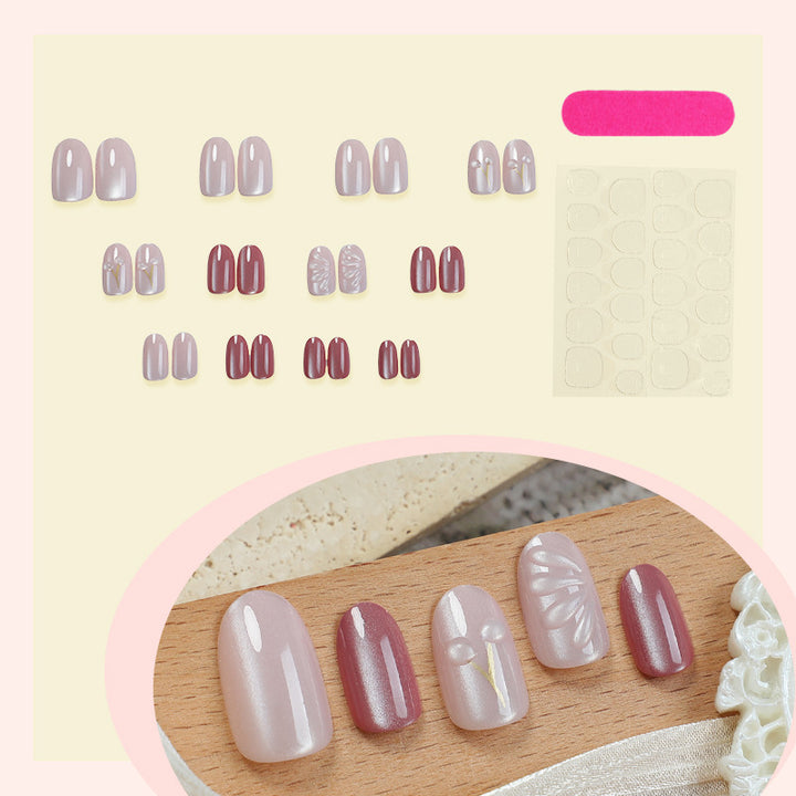 Acrylic nail set with elegant high-gloss finish and creative embellishments Bowlift