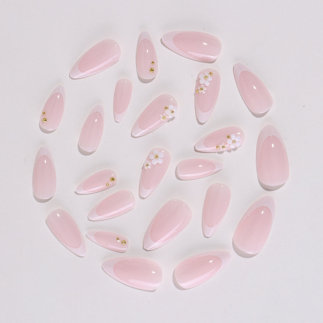 Artificial nail set with elegant floral accents and glitter Bowlift