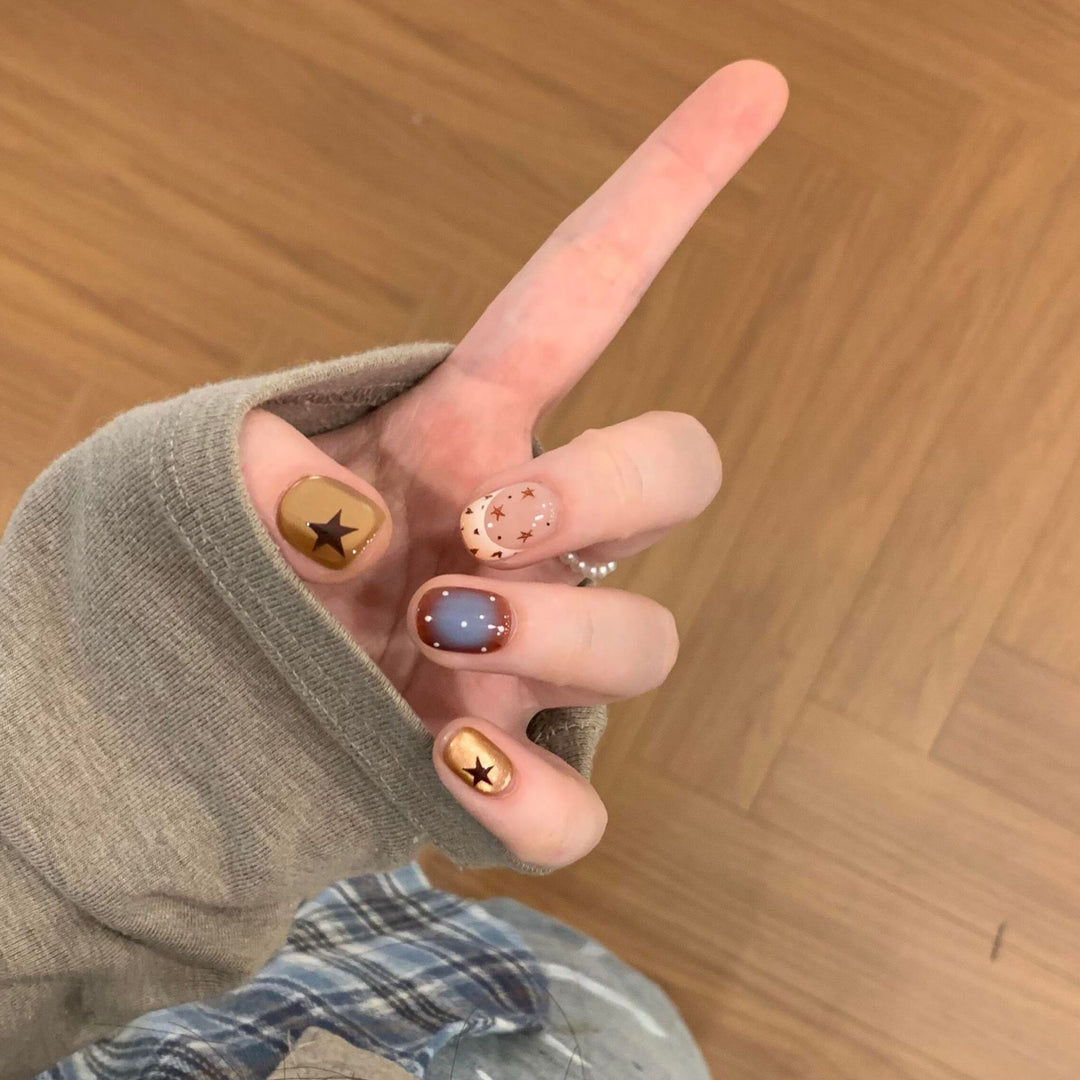 Artificial nails in modern design with star and gradient elements Bowlift