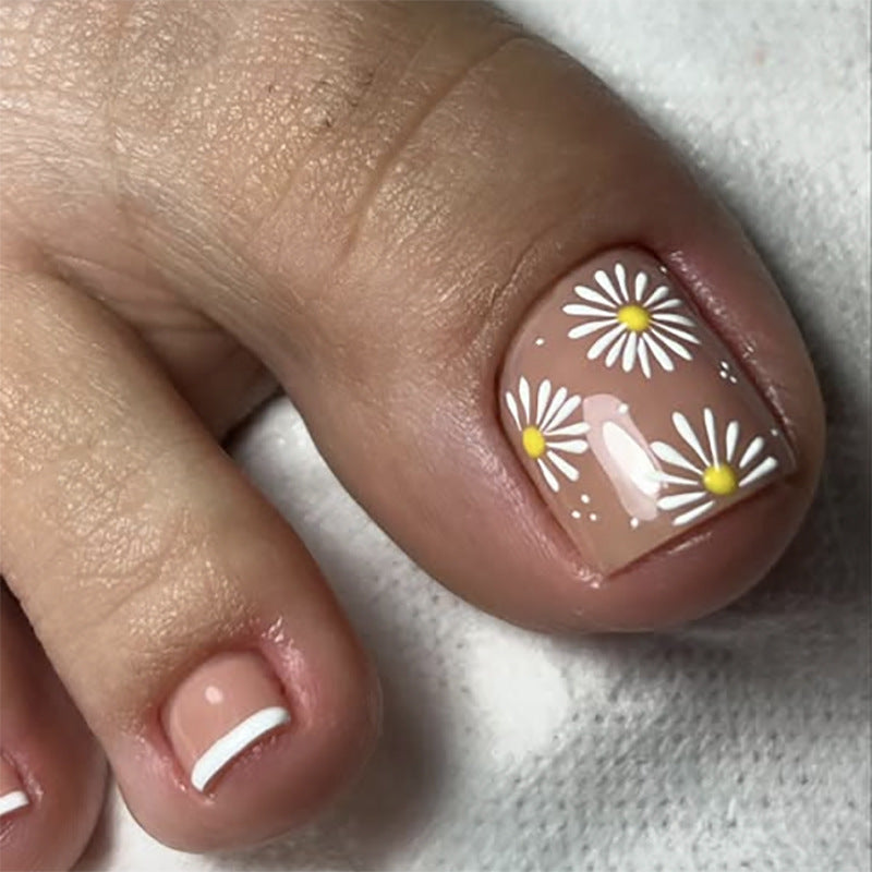 Artful toenail decoration with elegant gold accent Bowlift