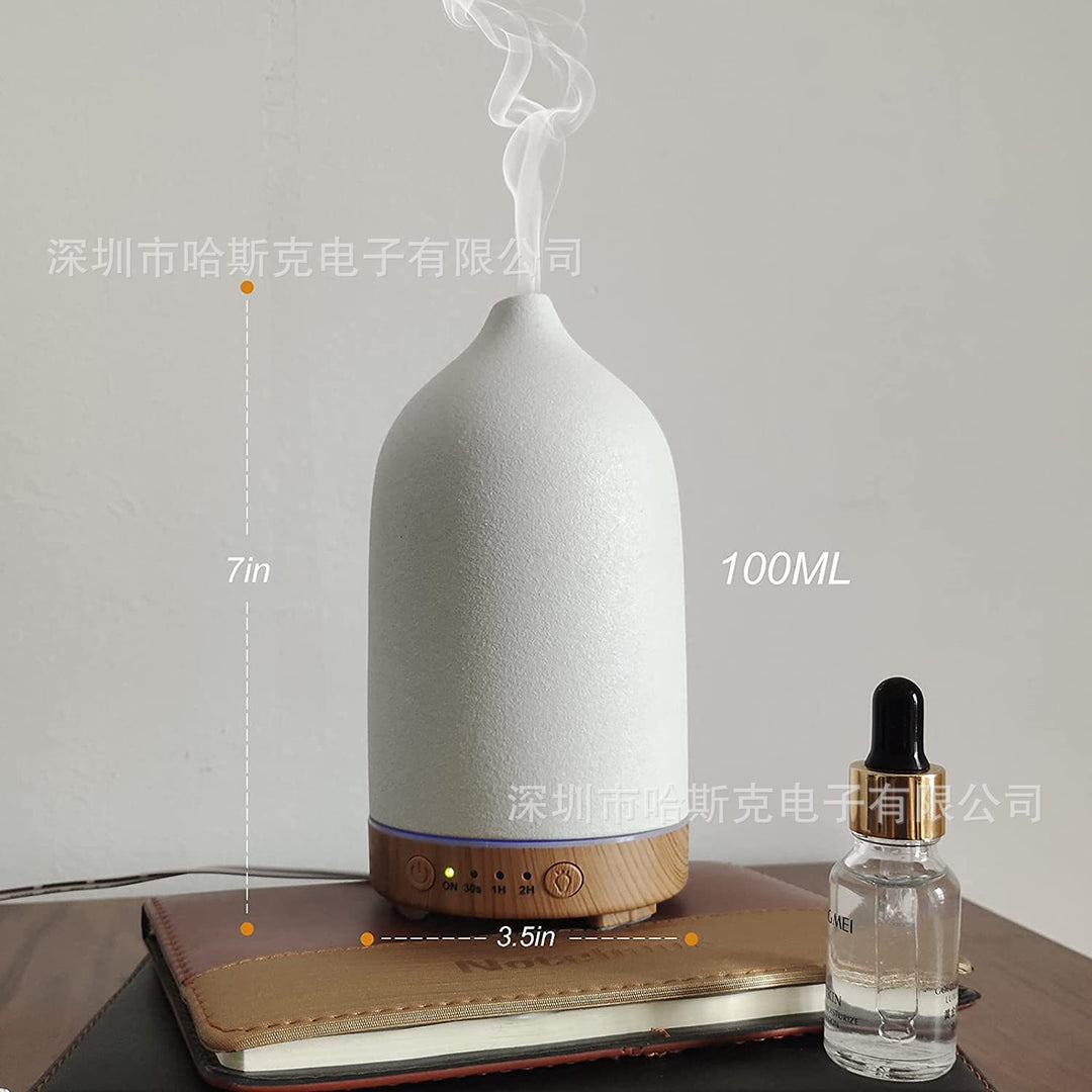 Ultrasonic essential oil diffuser with wood grain base and matte textured ceramic cover Bowlift