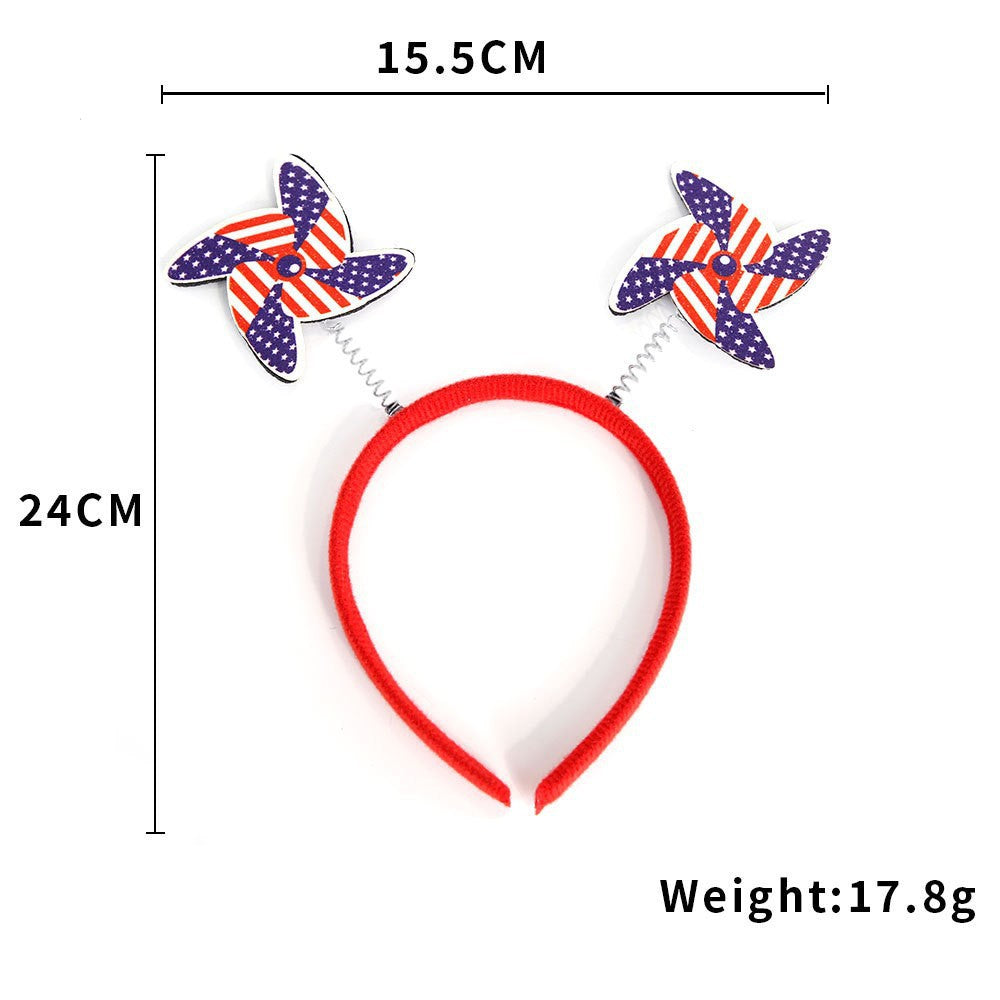 Unisex nan eye-catching party headband with attached pom poms, star tinsel, and small flag pendants Bowlift
