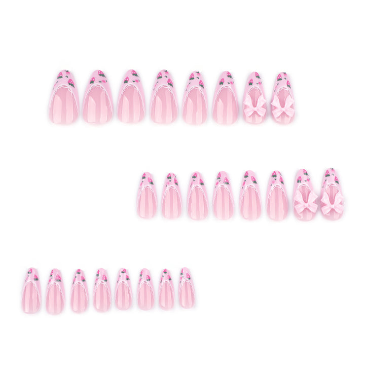 Artful stiletto nails with floral accents and bow embellishments Bowlift