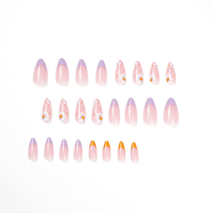 Artful nail art with floral accents and gradient colors Bowlift