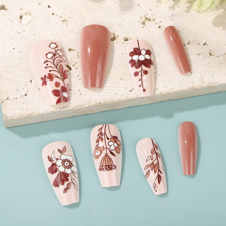 Artificial nails with filigree flower designs Bowlift