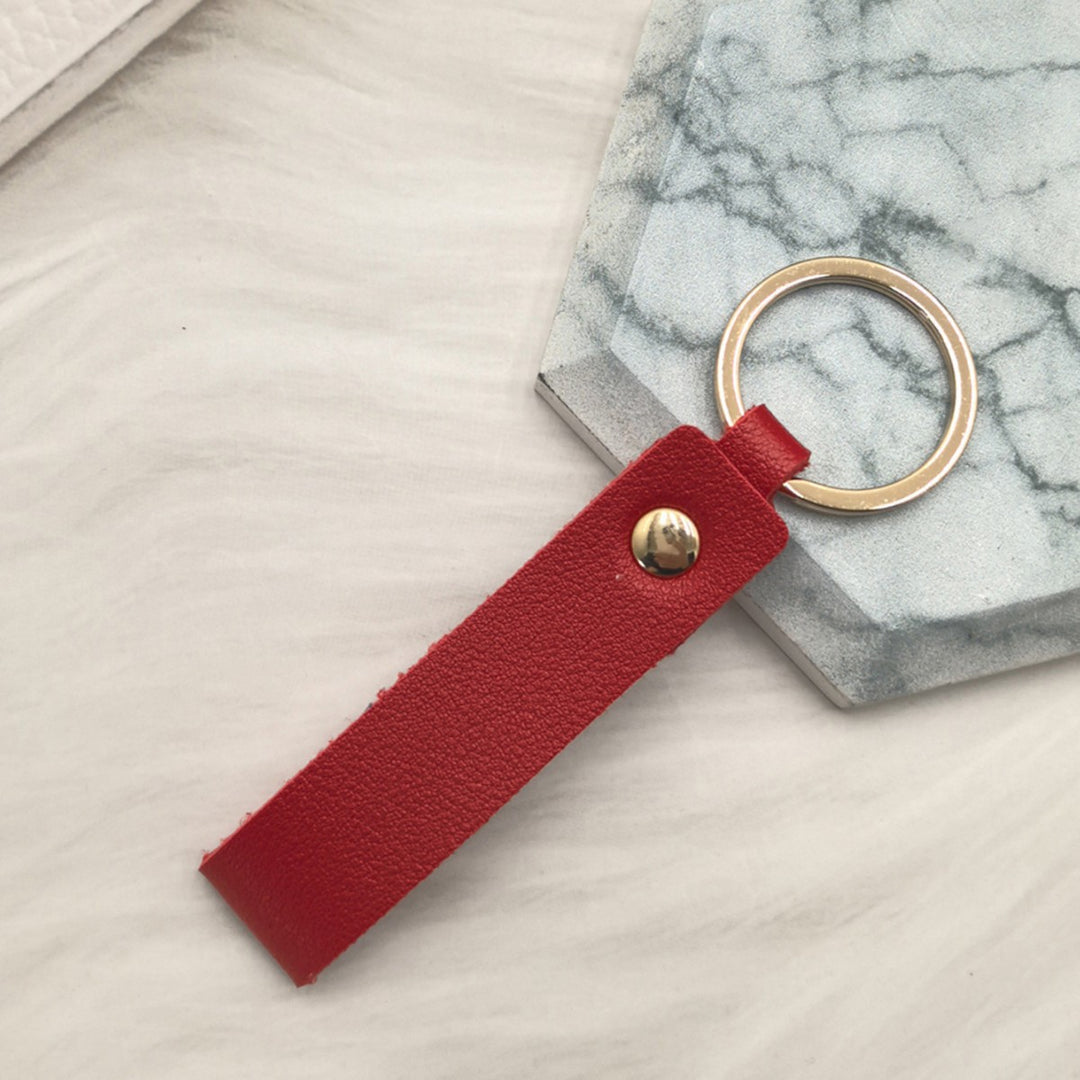 Unisex keychain made of high-quality synthetic leather with elegant metal embellishment Bowlift