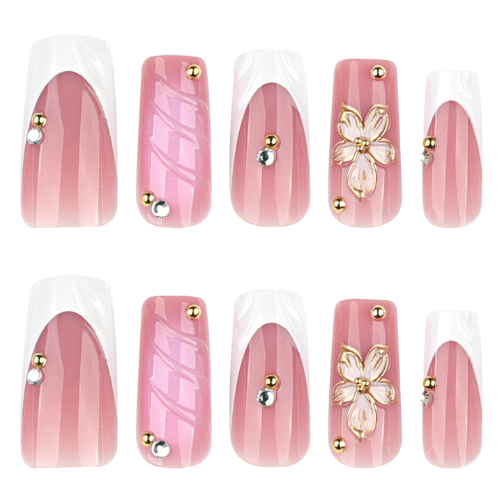Glamorous gel nails with floral accent and glitter details Bowlift