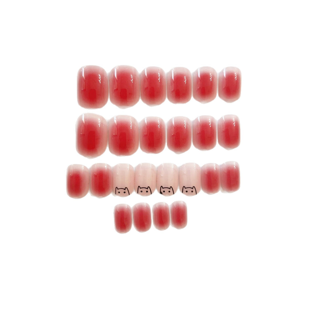 Artificial nails with elegant ombre effect and playful cat design Bowlift