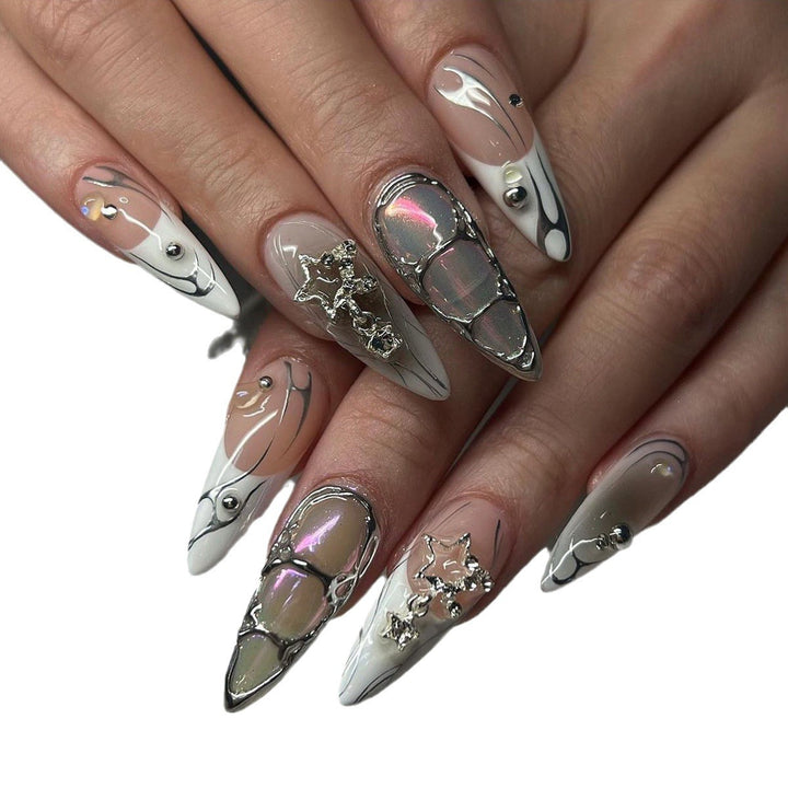 Artistic Stiletto Nail Extensions with Metallic Accents Bowlift