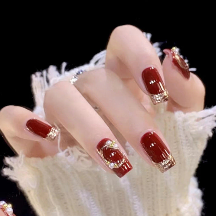 Artistic Nail Art with Glitter and Flower Applications Bowlift