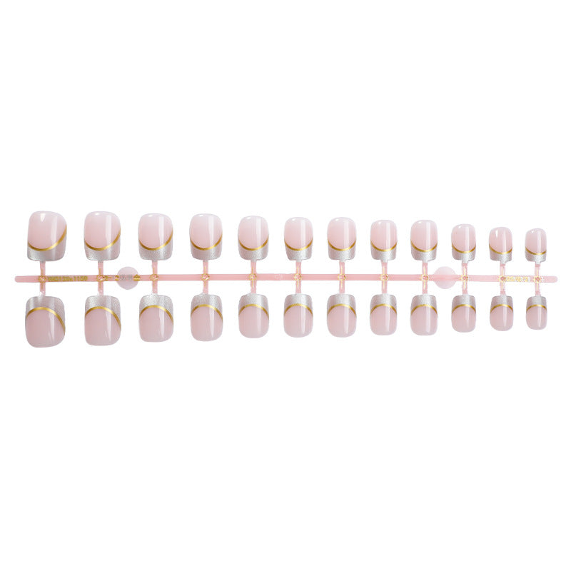 Artificial nail creations with elegant gold trim Bowlift