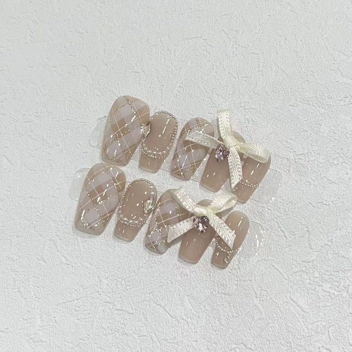 Elegant Press-On Nail Art Set with Ribbons and Gemstone Accents Bowlift
