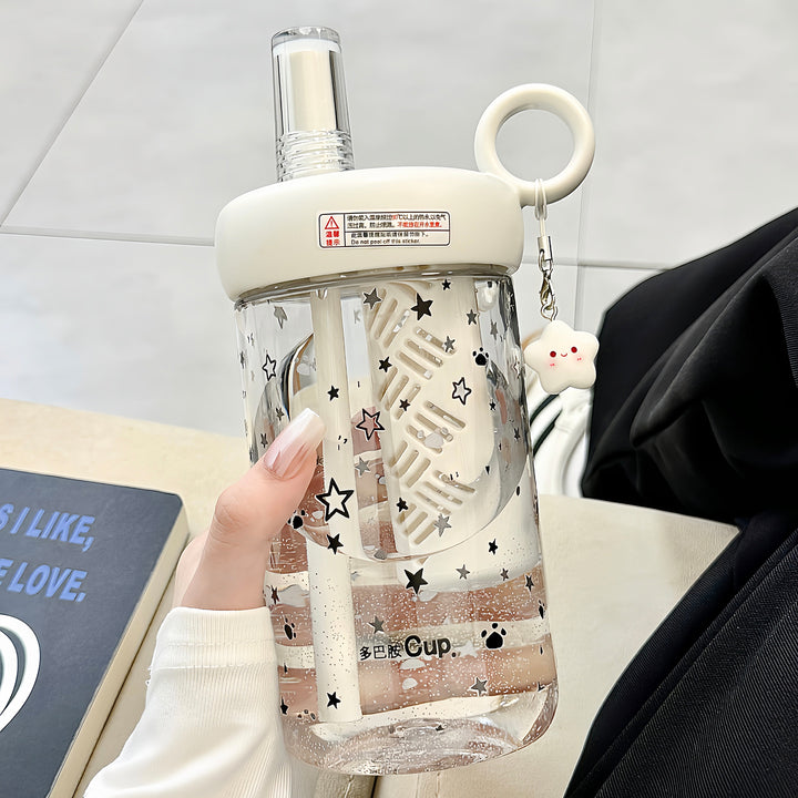 Women’s drinking bottle with integrated fruit filter and charming pendant Bowlift